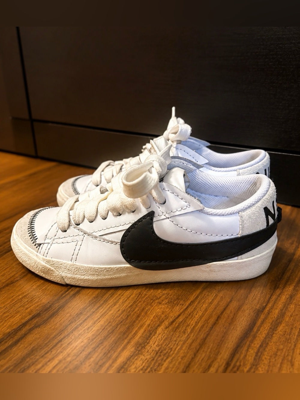 Nike Kids White Sneakers with Black Swoosh